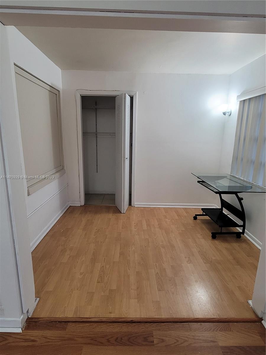 22780 Family Circle Boca Raton, FL 33428 - Photo 15 of 19 a view of a room with wooden floor