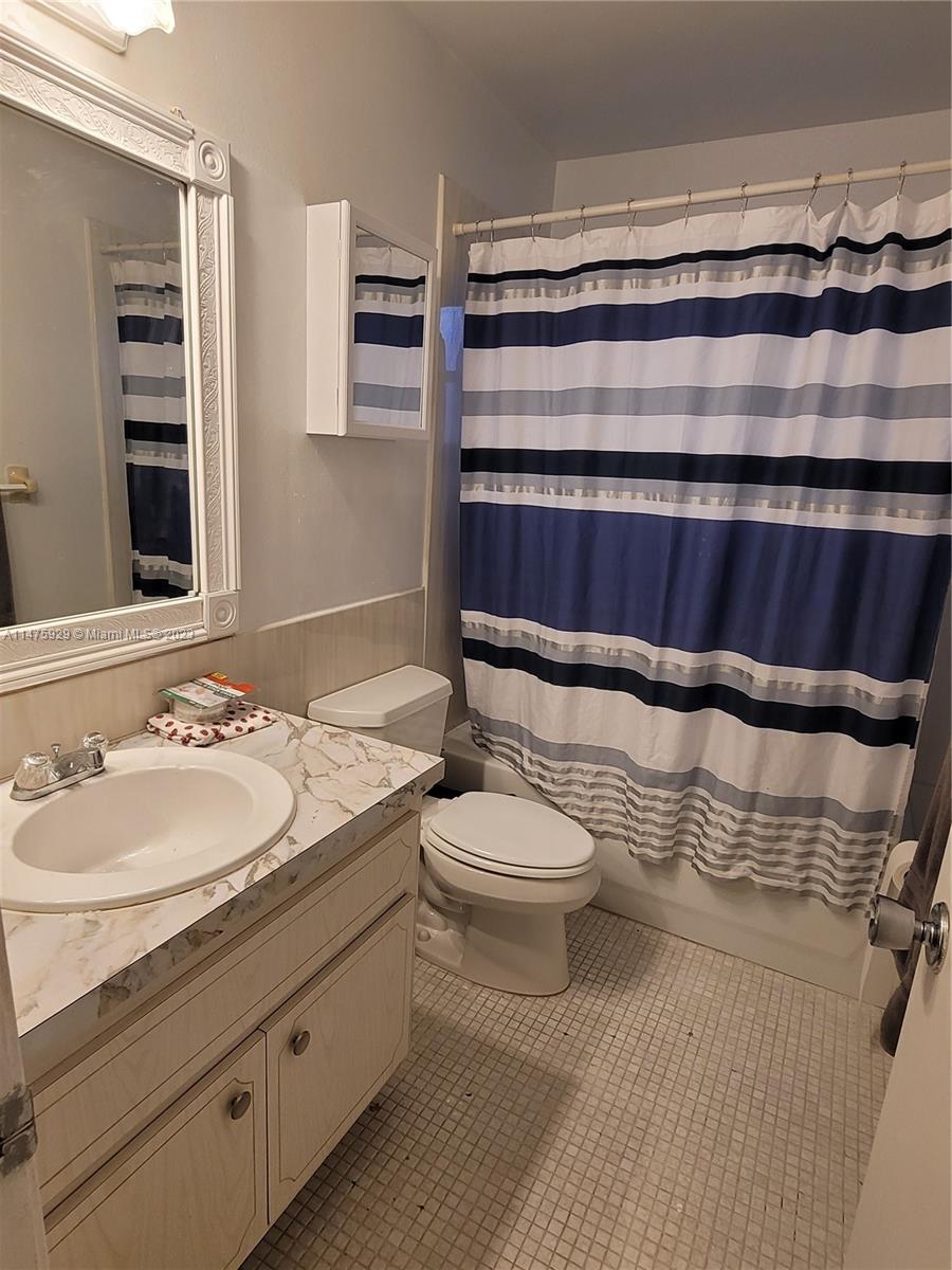 22780 Family Circle Boca Raton, FL 33428 - Photo 16 of 19 a bathroom with a sink and a toilet