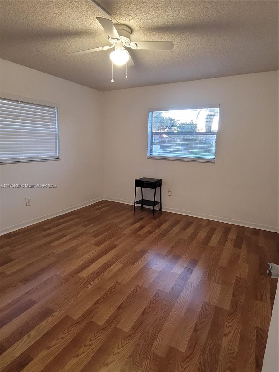 22780 Family Circle Boca Raton, FL 33428 - Photo 17 of 19 a view of a livingroom with wooden floor