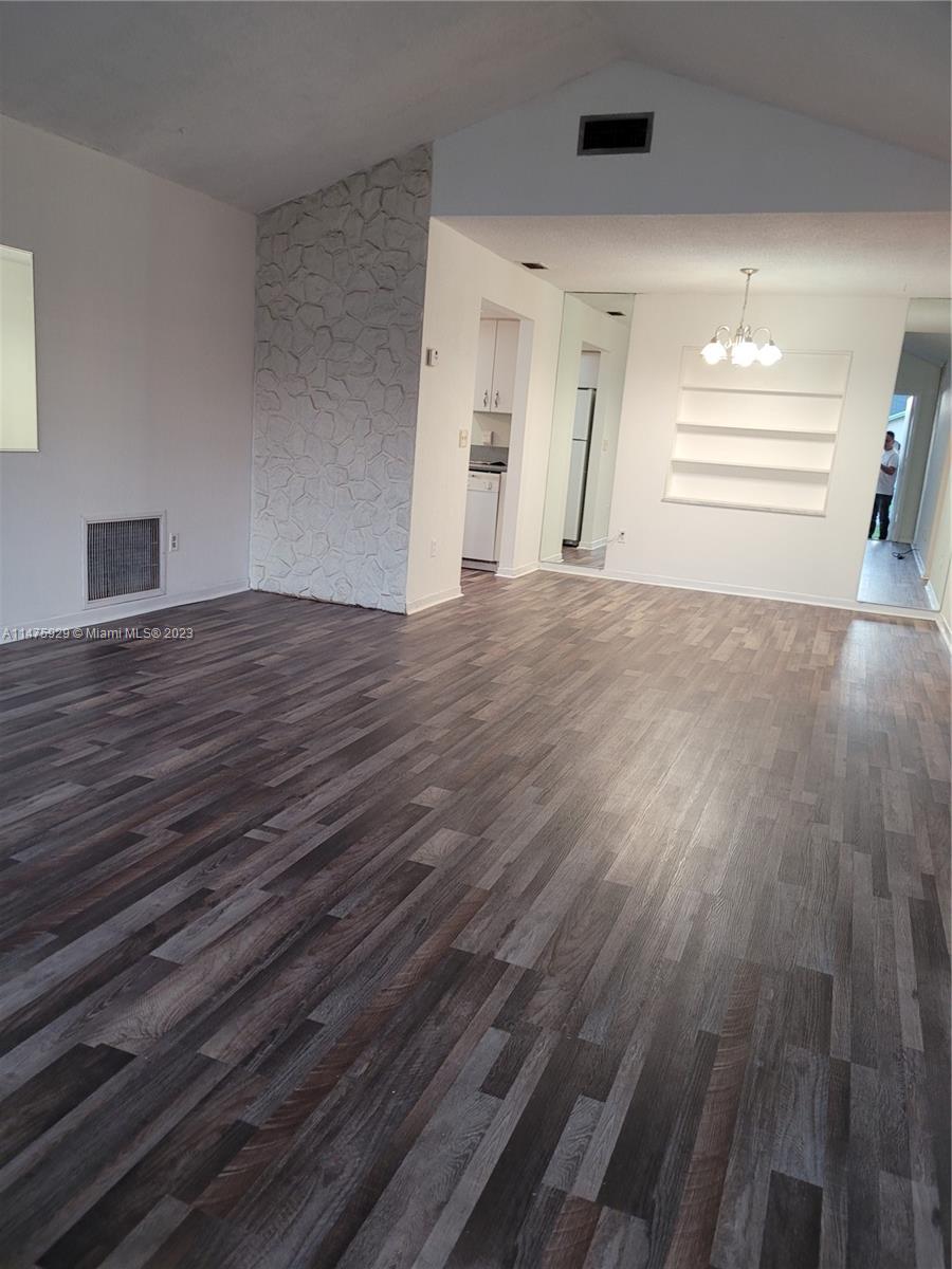 22780 Family Circle Boca Raton, FL 33428 - Photo 19 of 19 a view of empty room with wooden floor