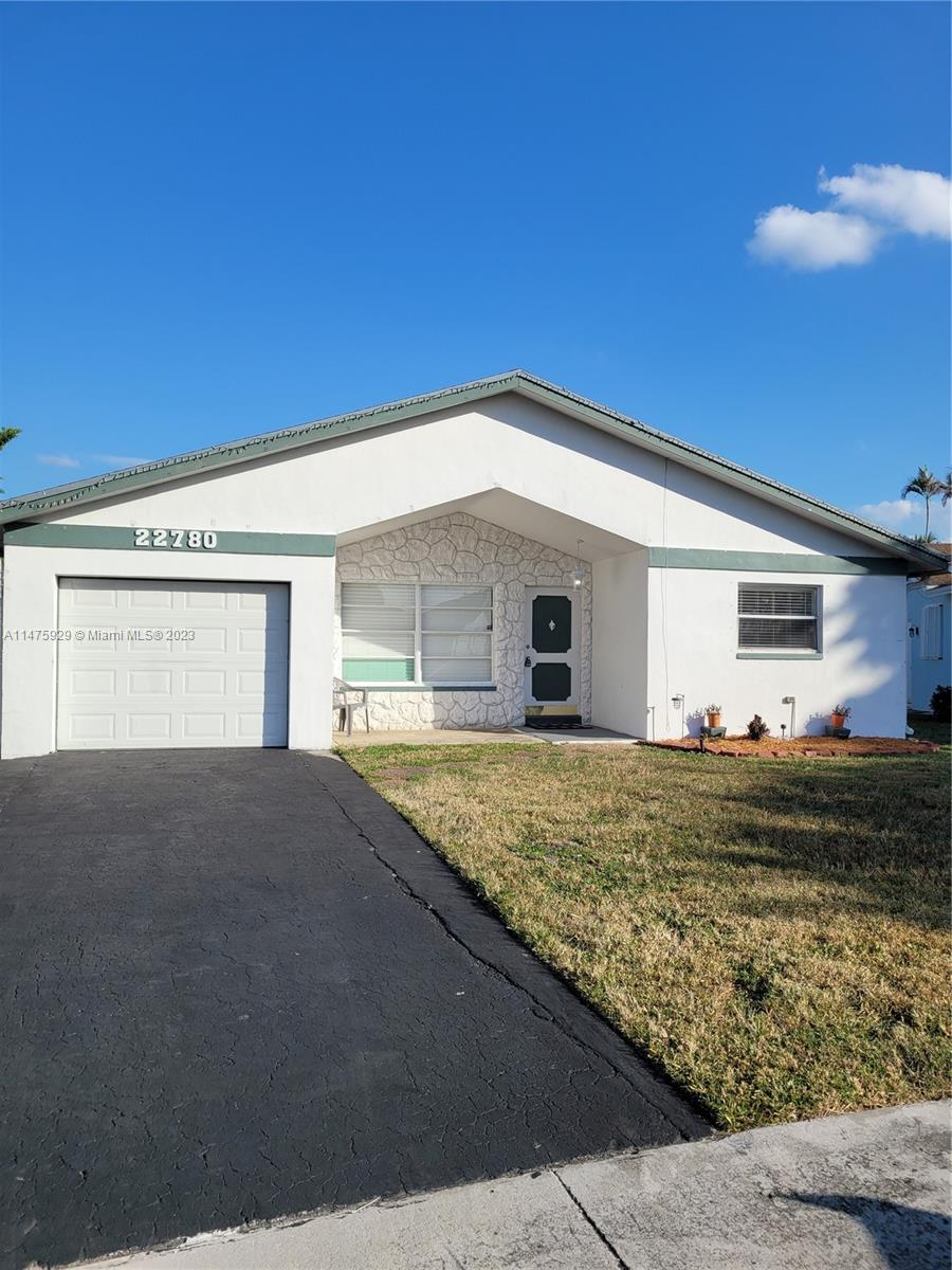 22780 Family Circle Boca Raton, FL 33428 - Photo 3 of 19 a house view with a outdoor space