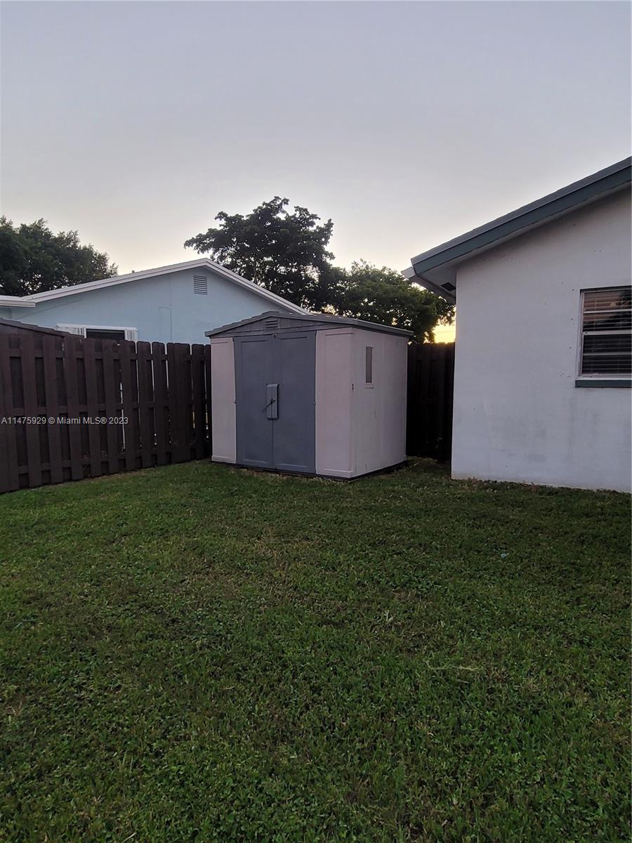 22780 Family Circle Boca Raton, FL 33428 - Photo 5 of 19 a view of a backyard