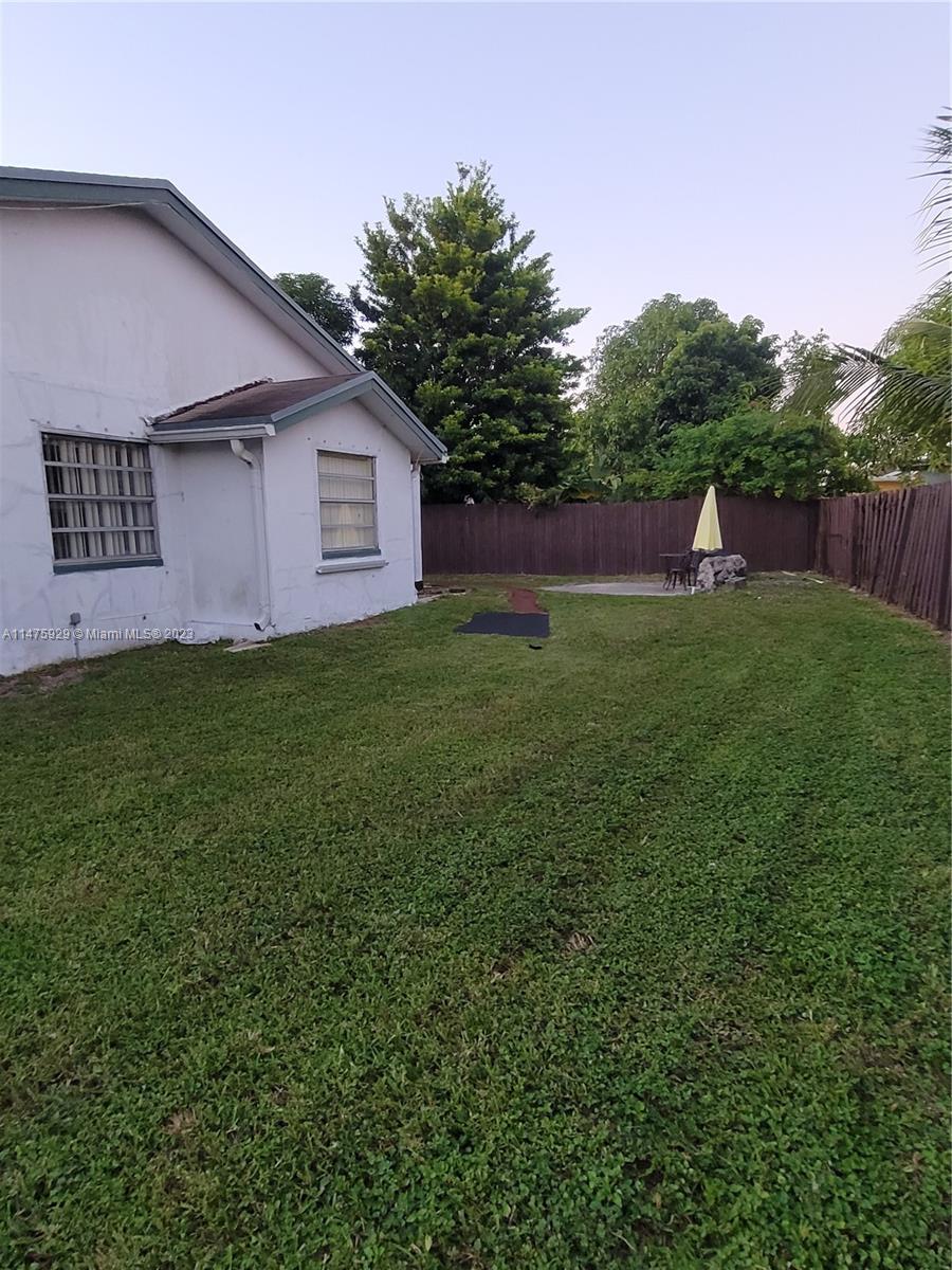 22780 Family Circle Boca Raton, FL 33428 - Photo 8 of 19 a view of a house with backyard