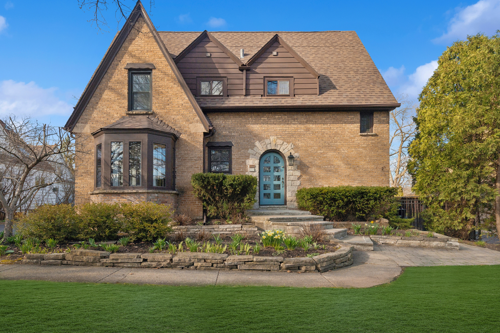 a front view of a house with garden