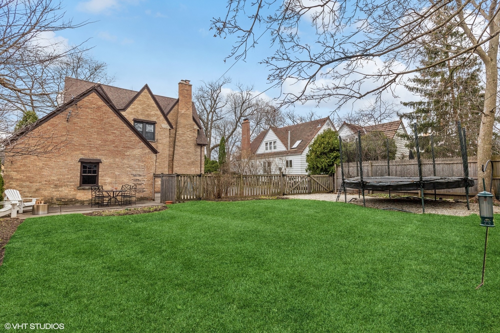 660 Northmoor Road Lake Forest, IL 60045 - Photo 20 of 24 a view of backyard with barbeque oven and a tree