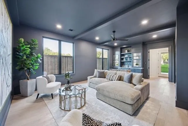 a living room with furniture and a large window