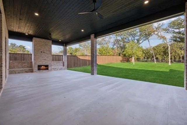 a view of a porch with furniture and a yard