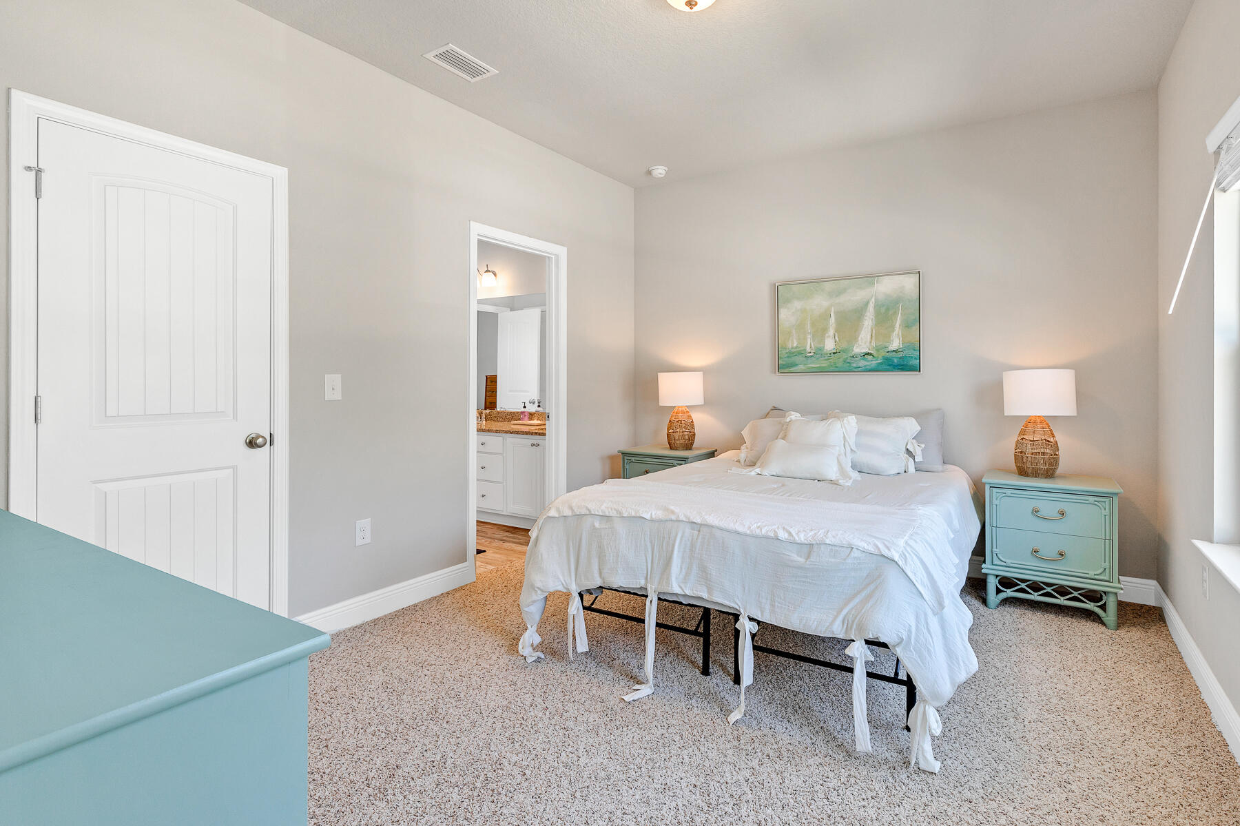 186 Southern Pnes Road Santa Rosa Beach, FL 32459 - Photo 21 of 32 a bedroom with a bed and a table in it