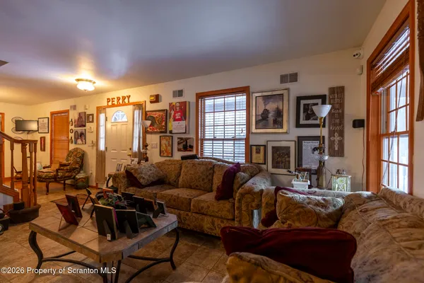 a living room with furniture and a large window