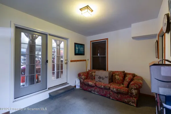 a spacious bedroom with a bed and window