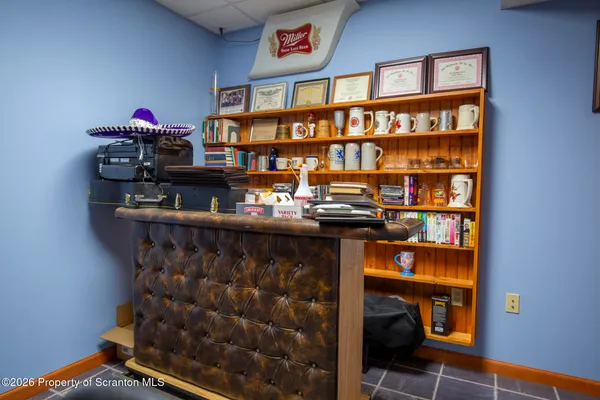 a room with bookshelf and a book shelf