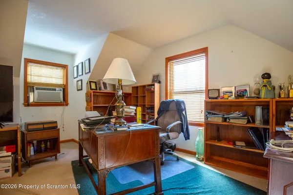 a room with furniture and a wooden floor