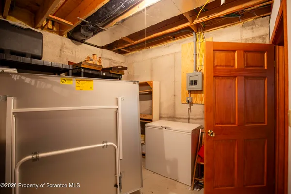 a view of walk in closet with clothes