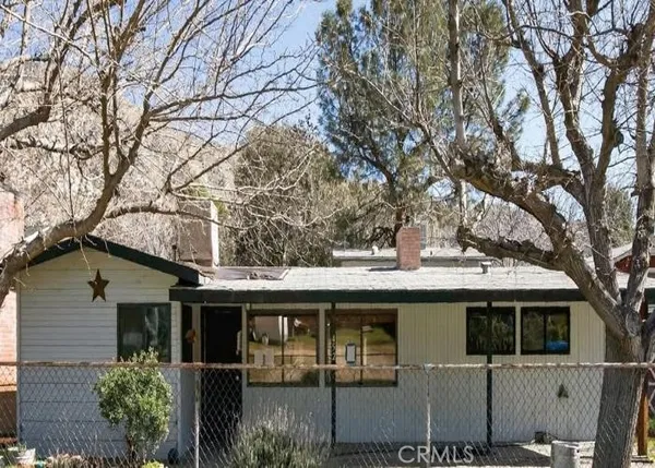 a view of a house with a tree