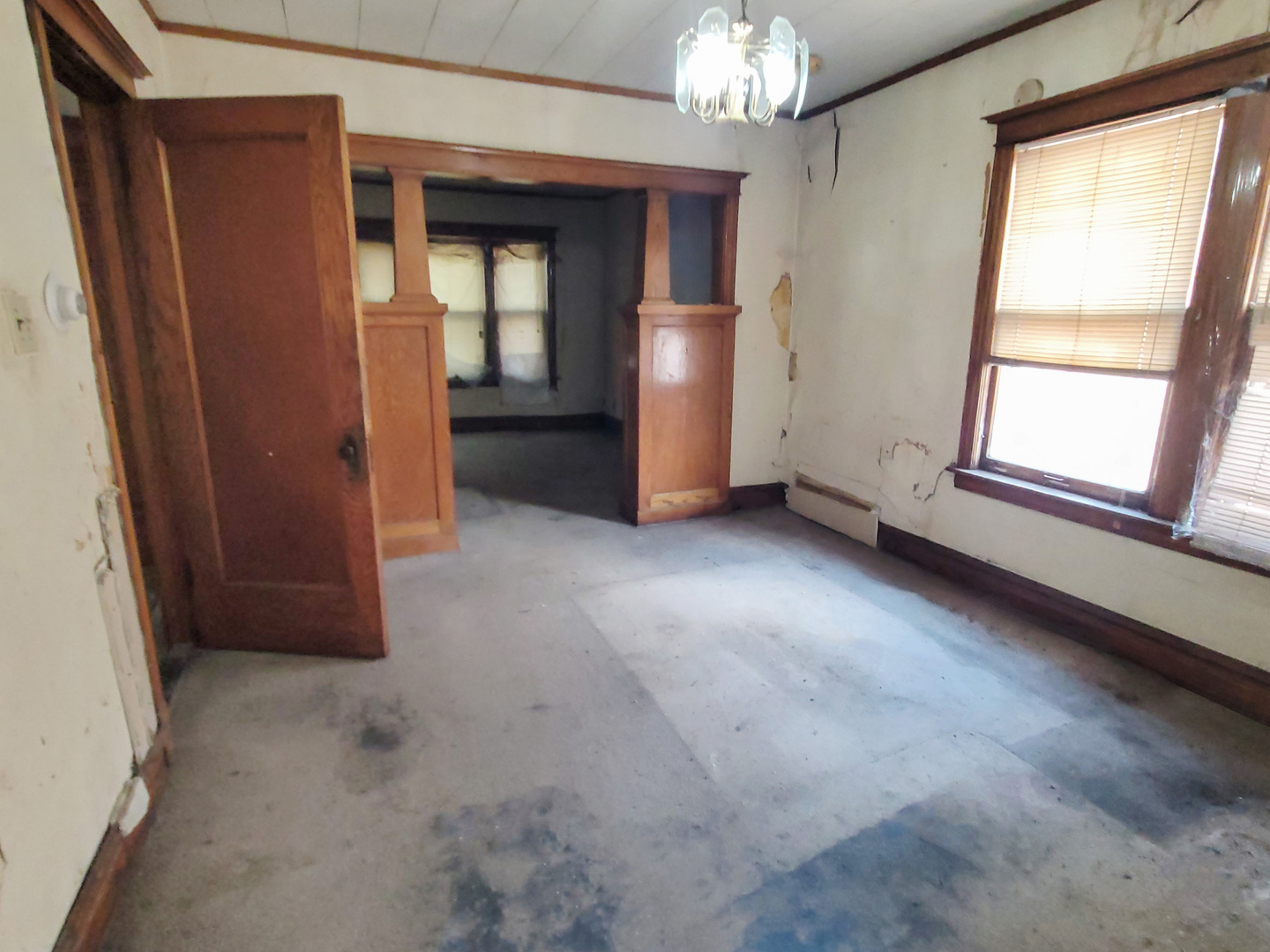 2641 West 69th Street Chicago, IL 60629 - Photo 14 of 16 an empty room with a fireplace and windows