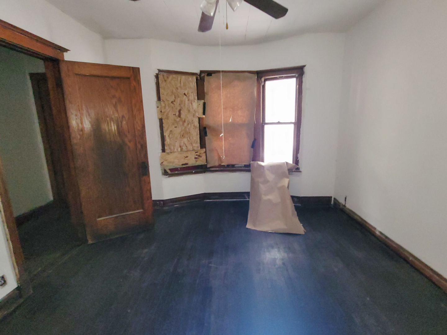 2641 West 69th Street Chicago, IL 60629 - Photo 9 of 16 a view of empty room with wooden floor and fan