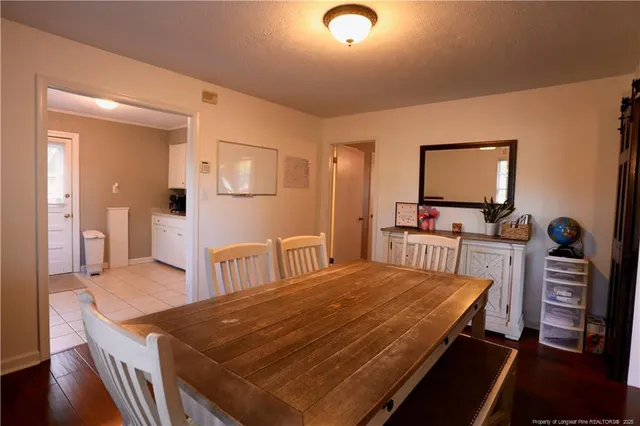 a bedroom with a bed and a table in it