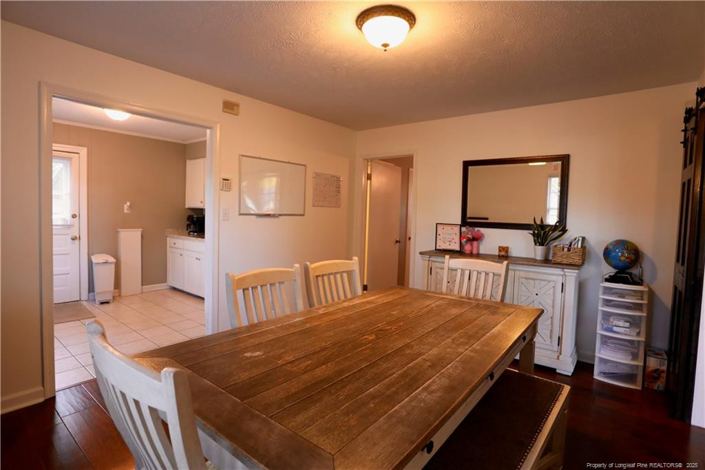 948 Pinebluff Lake Road Aberdeen, NC 28315 - Photo 14 of 32 a bedroom with a bed and a table in it