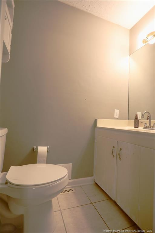 948 Pinebluff Lake Road Aberdeen, NC 28315 - Photo 26 of 32 a bathroom with a sink a toilet and a mirror