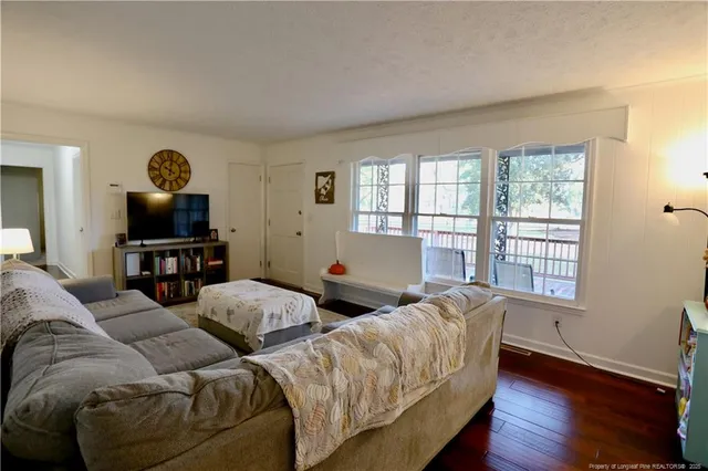 a living room with furniture and a window