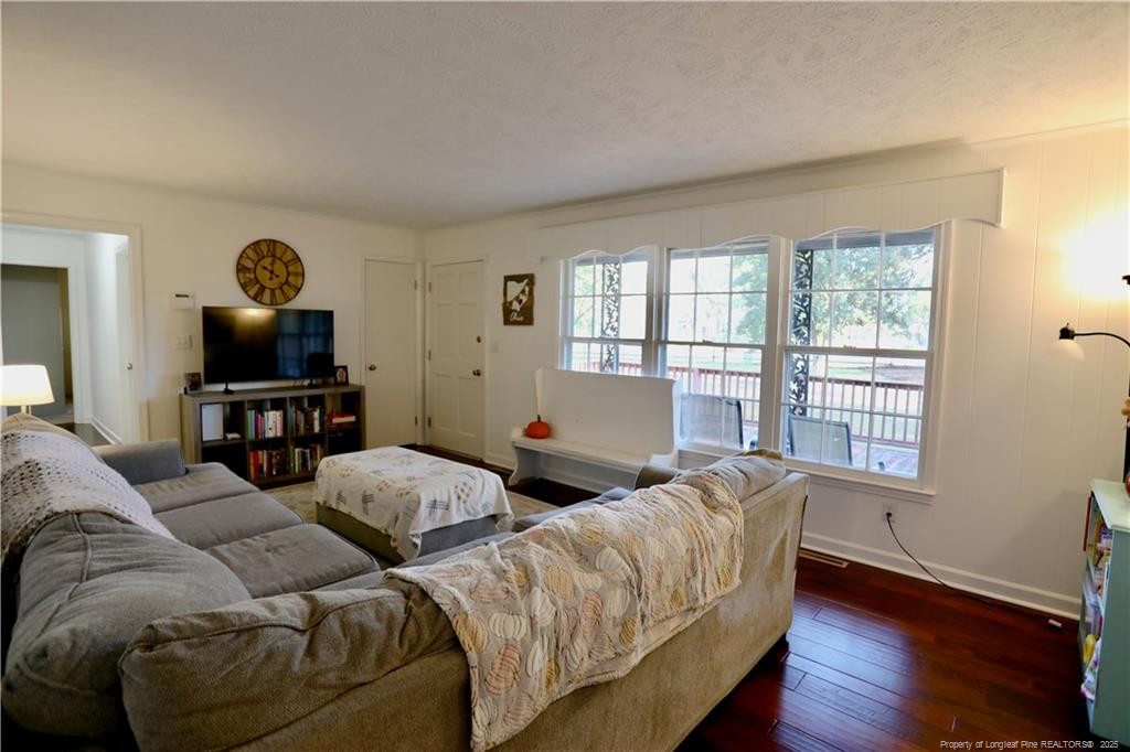 948 Pinebluff Lake Road Aberdeen, NC 28315 - Photo 8 of 32 a living room with furniture and a window