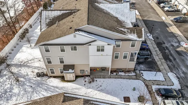 a view of a house with pool and chairs