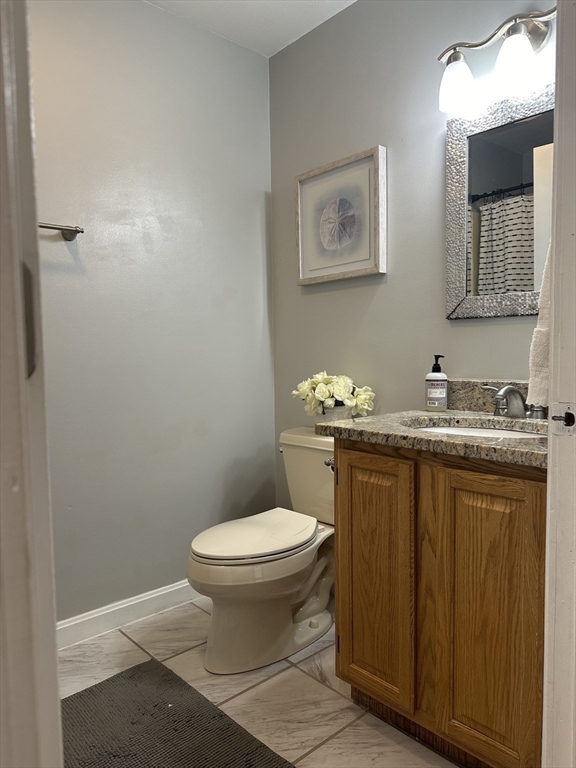 119 Laurel View Road Templeton, MA 01468 - Photo 16 of 28 a bathroom with a granite countertop toilet sink and mirror