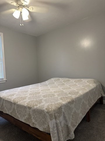 119 Laurel View Road Templeton, MA 01468 - Photo 20 of 28 a bedroom with a bed and a chandelier