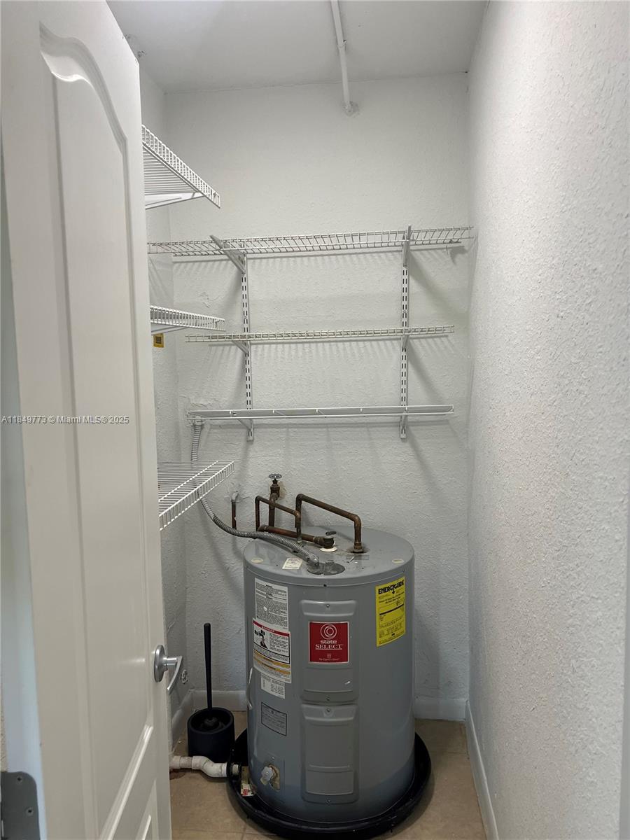 8950 Southwest 69th Court, Unit 312 Pinecrest, FL 33156 - Photo 13 of 13 a utility room with dryer and washer