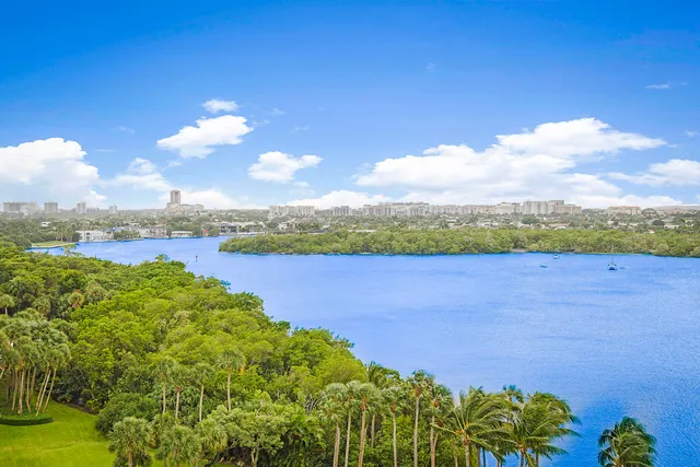 a view of a lake with houses in the back