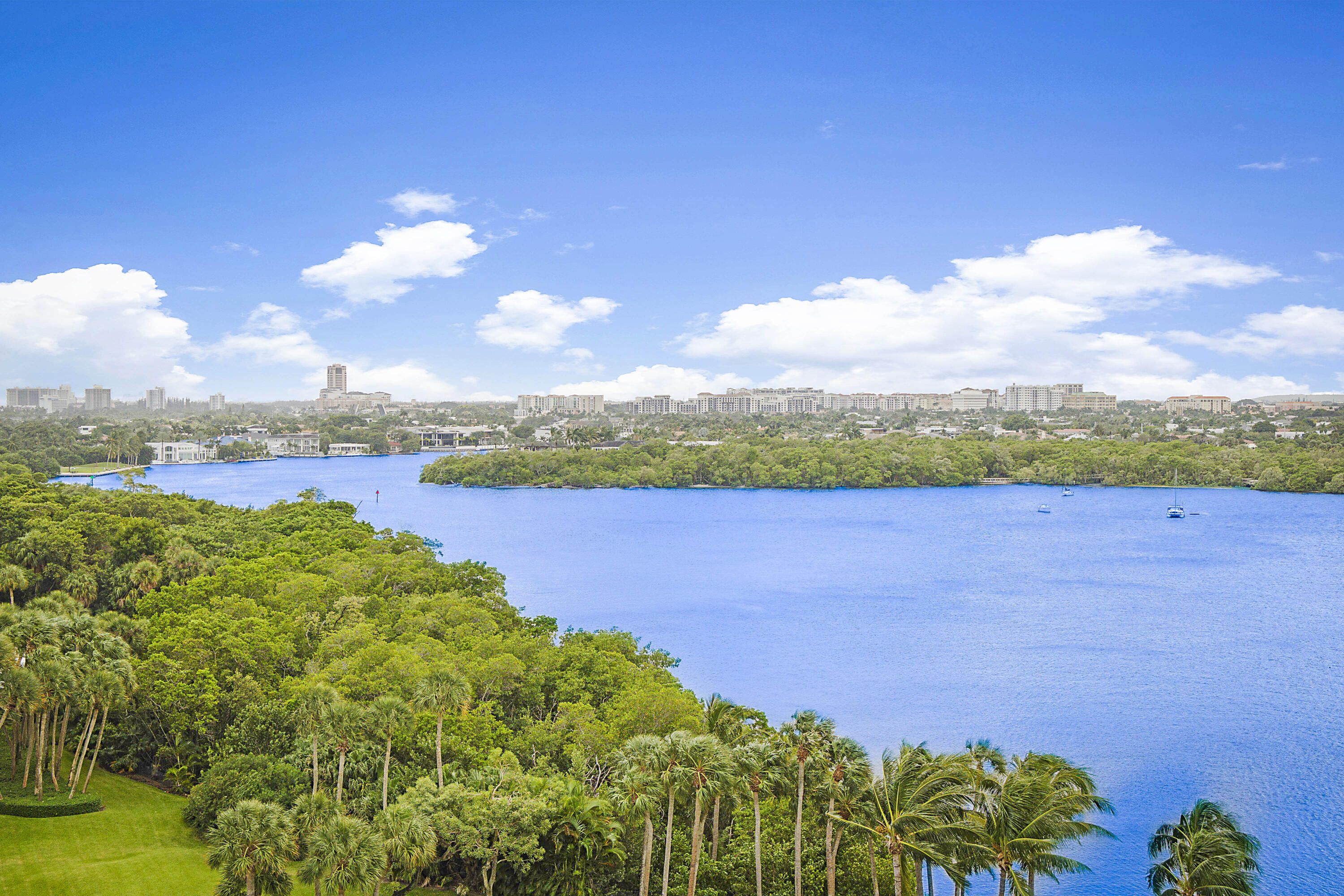 a view of a lake with houses in the back