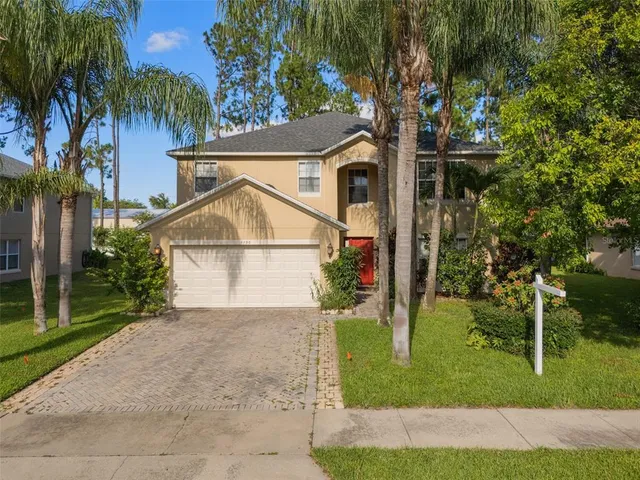 a view of a house with a yard and plants