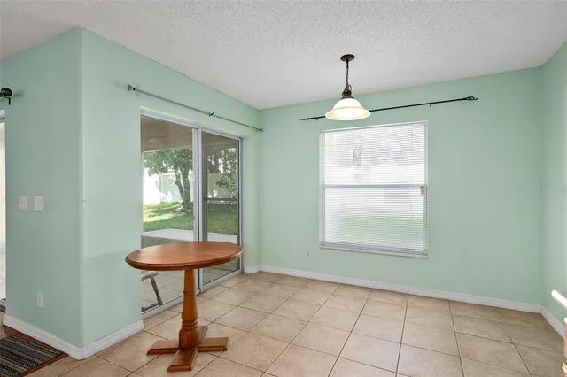 a room with window and chandelier