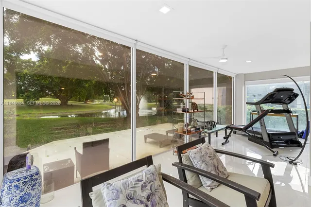 a room with view of living room with furniture and floor to ceiling window