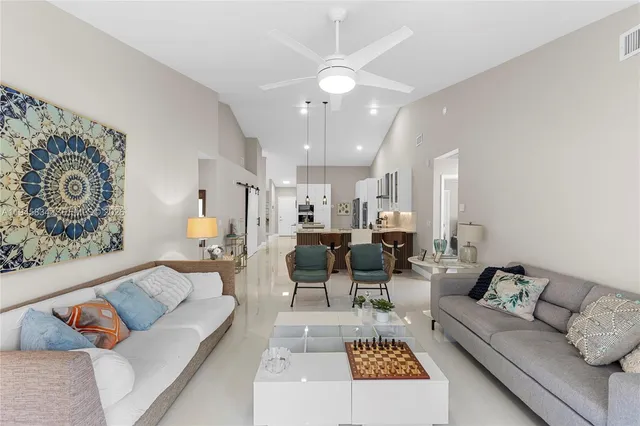 a living room with furniture and a rug