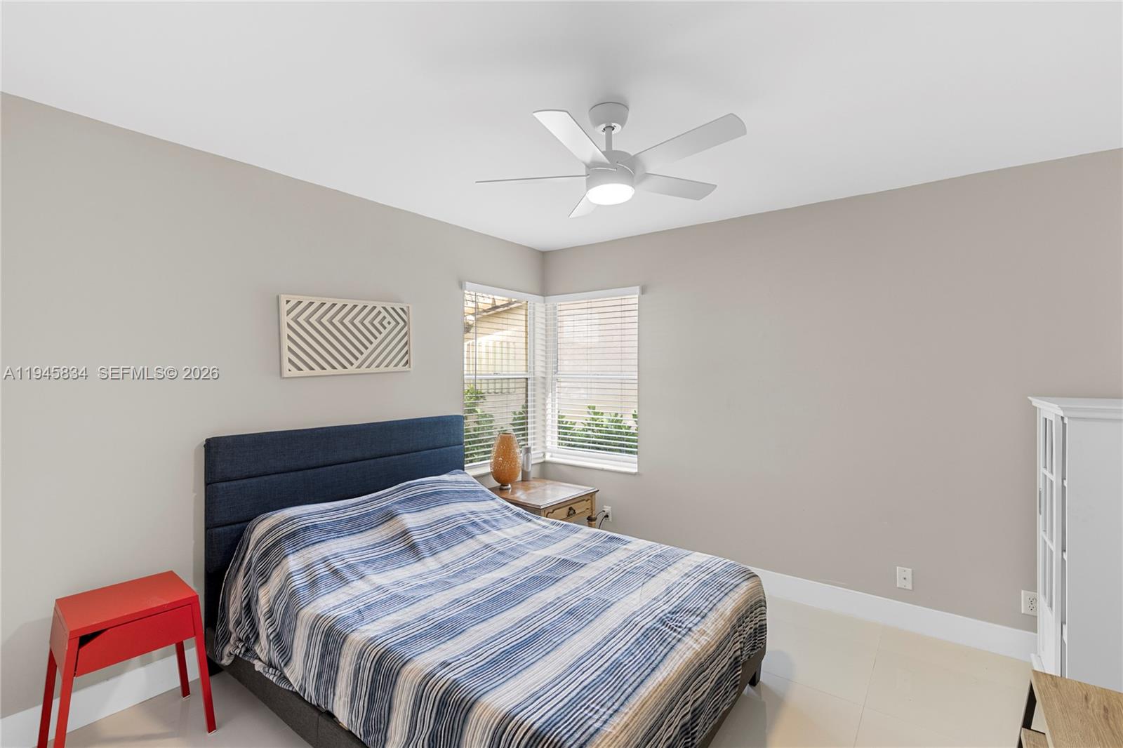 19648 Back 9 Drive Boca Raton, FL 33498 - Photo 23 of 45 a bedroom with a bed and a chandelier