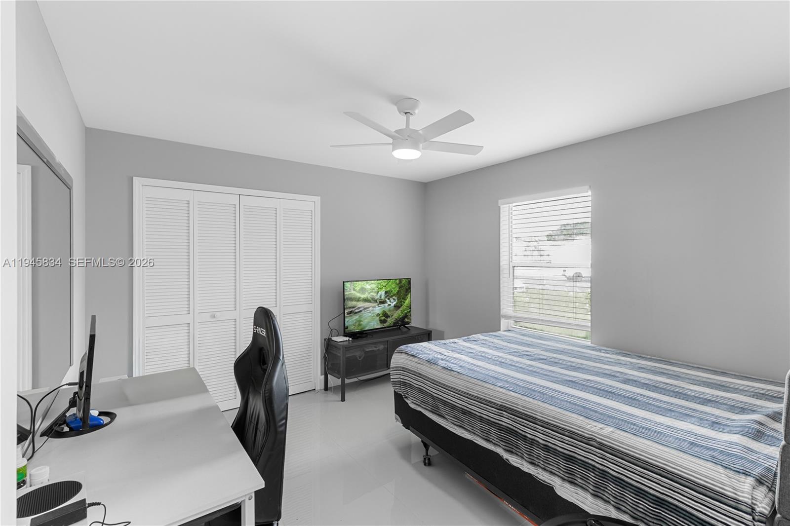 19648 Back 9 Drive Boca Raton, FL 33498 - Photo 24 of 45 a bedroom with furniture and a window