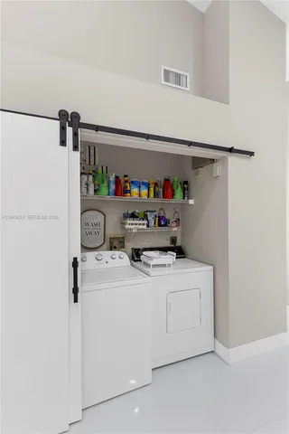 a utility room with dryer and washer