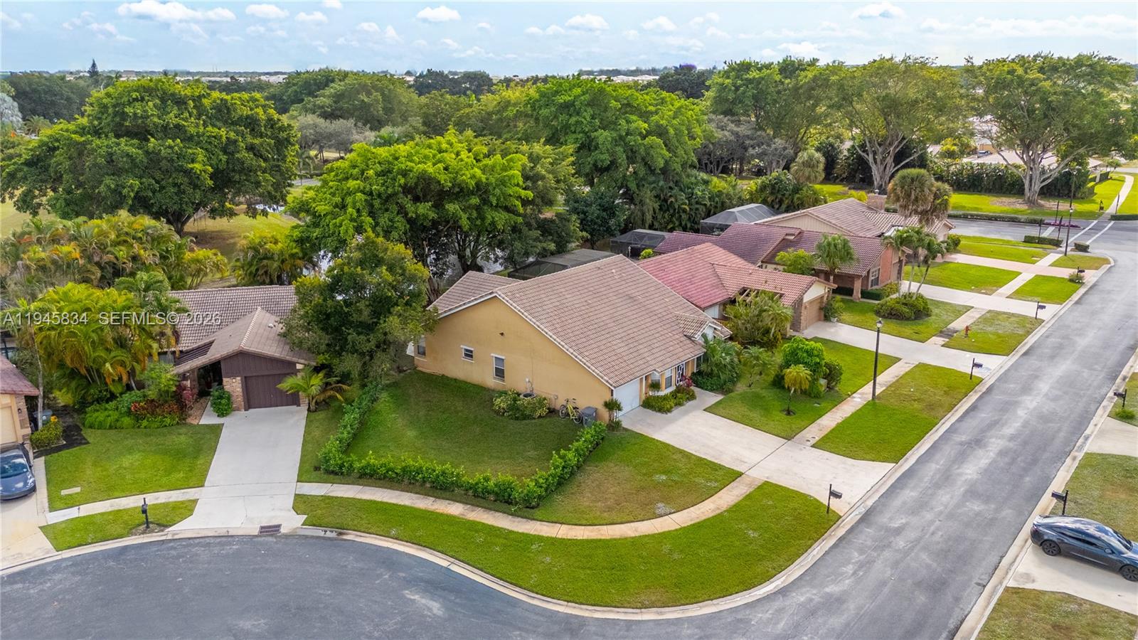 19648 Back 9 Drive Boca Raton, FL 33498 - Photo 3 of 45 an aerial view of residential house with outdoor space and trees