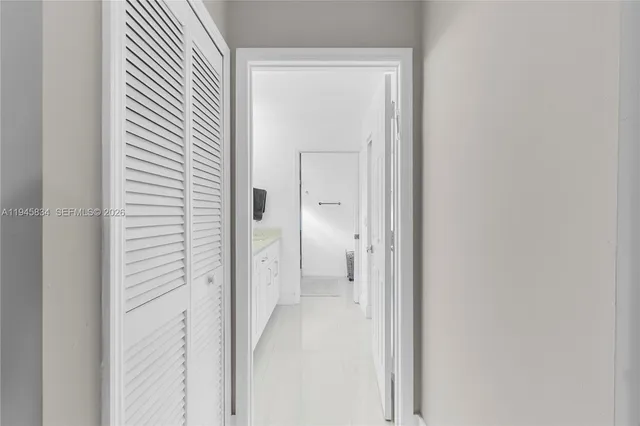 a view of a bathroom from a hallway
