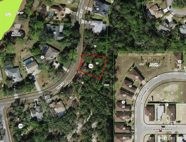 an aerial view of multi story residential apartment building with parking space