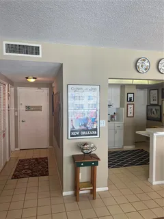 a view of kitchen with furniture and cabinets
