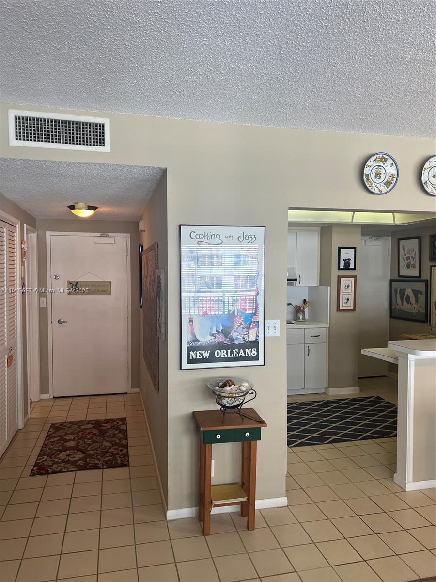 3800 Galt Ocean Drive, Unit 1403 Fort Lauderdale, FL 33308 - Photo 6 of 13 a view of kitchen with furniture and cabinets