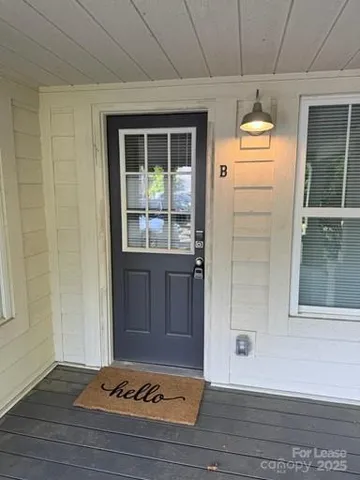 a view of a door and wooden floor