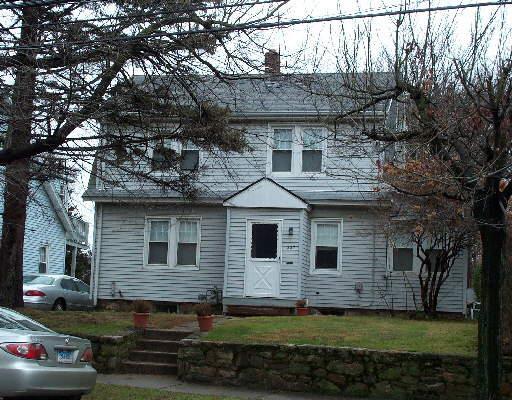337 Glenbrook Road Stamford, CT 06906 - Photo 1 of 1 a front view of a house with a garden