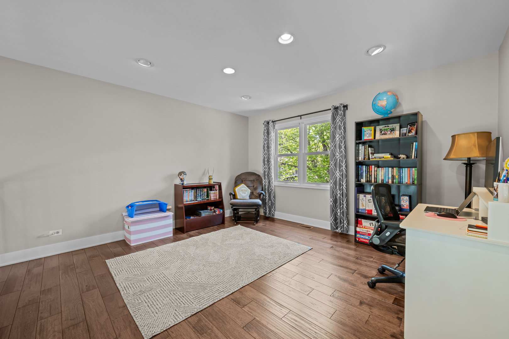 1631 Terri Circle Naperville, IL 60563 - Photo 17 of 39 a bed room with a bed and a book shelf