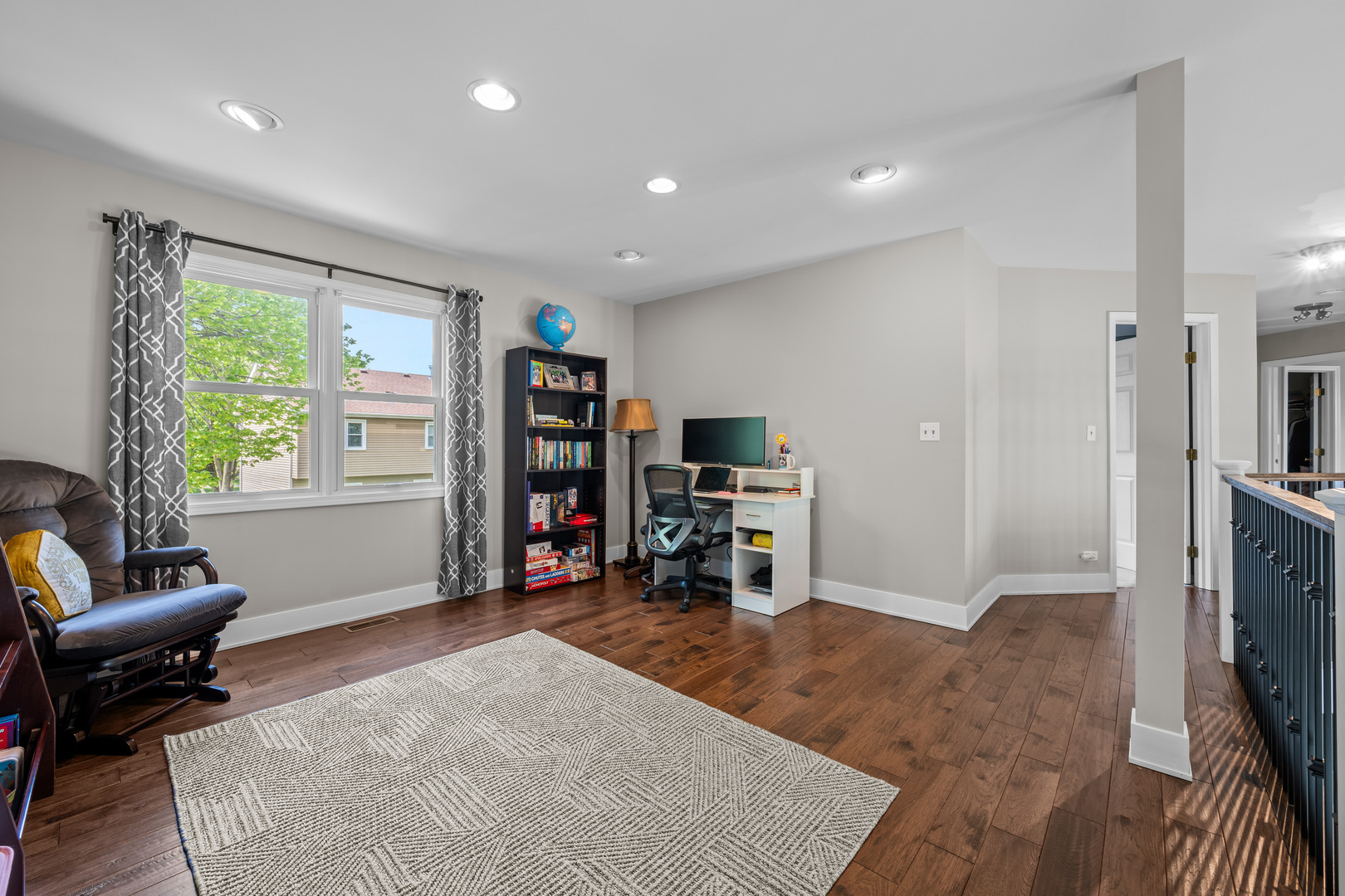 1631 Terri Circle Naperville, IL 60563 - Photo 18 of 39 a living room with furniture and a flat screen tv