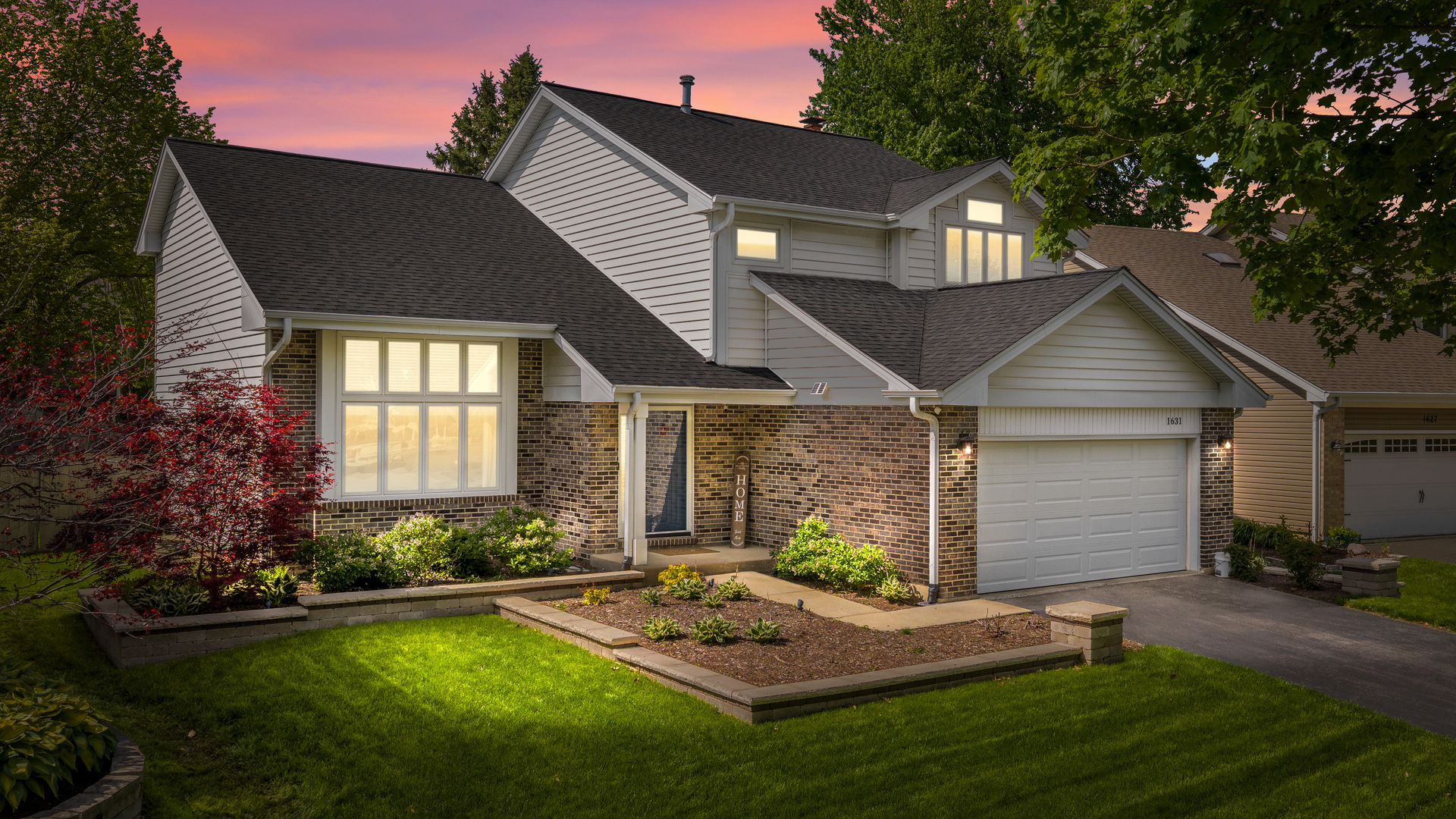 1631 Terri Circle Naperville, IL 60563 - Photo 2 of 39 a front view of house with yard and outdoor seating