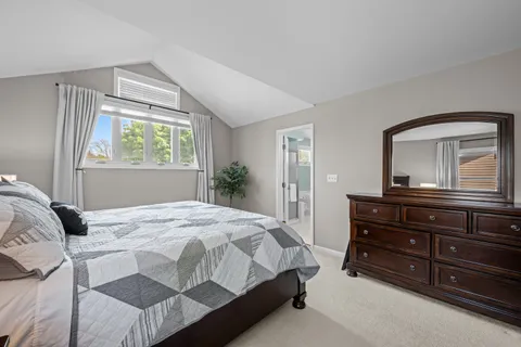 a bedroom with a bed and a dresser