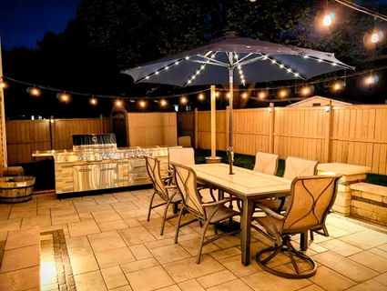 a patio with table and chairs